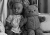 broken doll and scruffy teddy bear