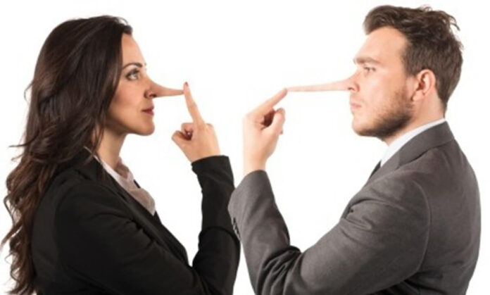 man and woman facing each other with long noses telling lies