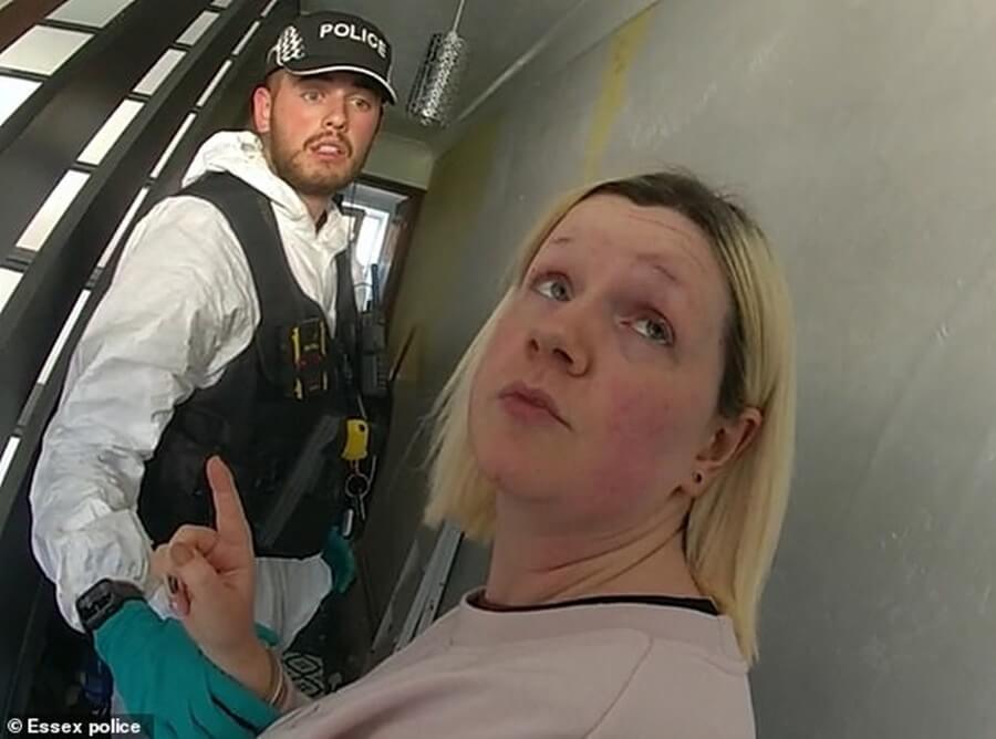 Virginia McCullough and a police officer during her arrest.