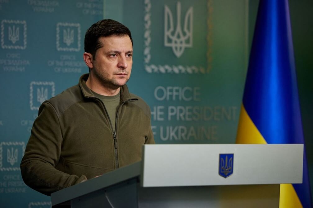 Ukrainian President Zelensky standing at a podium